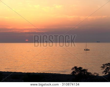 Sevastopol, Crimea - July 19, 2008: The Peninsula Of Crimea And Black Sea. Scarlet Sunset With Ships