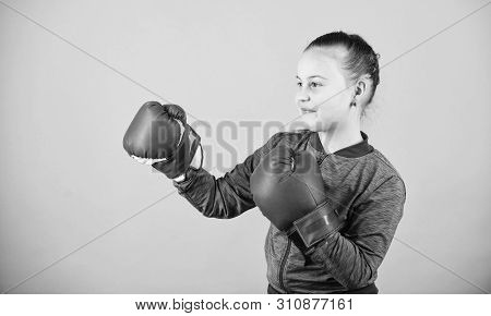 Contrary To Stereotype. Boxer Child In Boxing Gloves. Confident Teen. Enjoyment From Sport. Female B