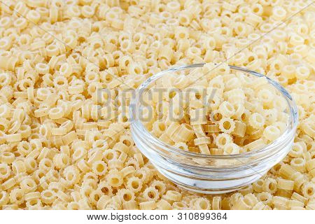 Close-up Shot Of Ditalini Italian Pasta. Pasta Background Pattern . Italian Food.