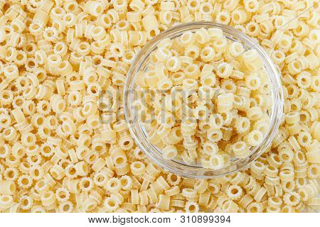 Close-up Shot Of Ditalini Italian Pasta. Pasta Background Pattern . Italian Food.