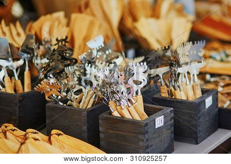 Traditional Finnish Cheese-cutter In Form Of An Elk Head And Kitchen Ustensils On Market In Helsinki