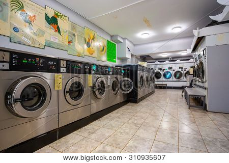 London, Uk - May 19 2018: Row Of Coin Laundries And Cloth Dryers In A Self-service Launderlette