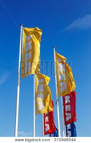 Huddinge, Sweden - July 11, 2019: A Close-up Of A Group Of Ikea Flags Outside The Store Located At K