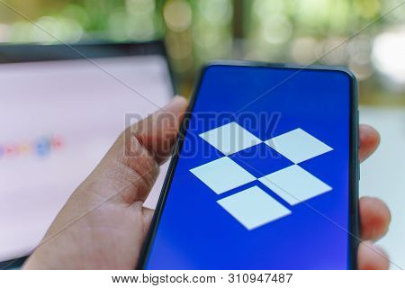 Chiang Mai, Thailand - May.26,2019: Man Holding Xiaomi Mi Mix 3 With Dropbox On Screen.dropbox Is A 