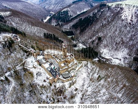 Aerial View Rock With Medieval Castle On It Near Moselle River In Brodenbach Winter With Forest Snow