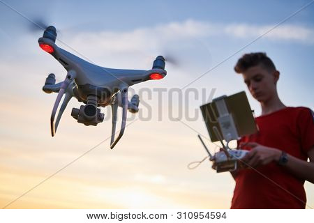drone flying. copter pilotage at sunset