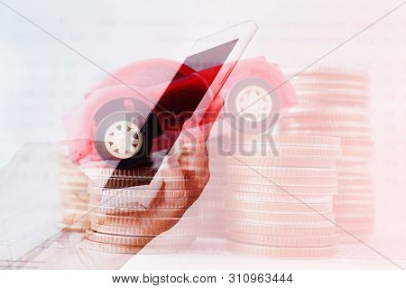 Double Exposure Of Hand With Mobile And Car On Stack Of Coins For Business And Finance Background