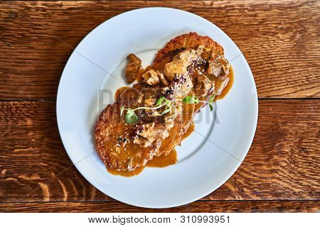 Fried potato pancakes with gulasch sauce
