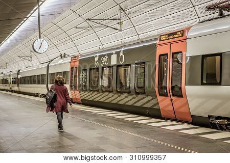 Woman Walking In The Underground Station Triangeln In Malmo, Sweden, May 23, 2019