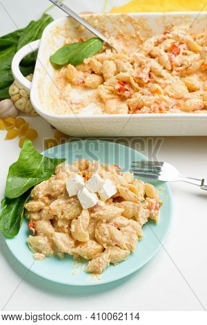 Trend Oven-baked Feta Cheese With Tomatoes And Pasta, Pepper Garlic On A Light Background Top View,