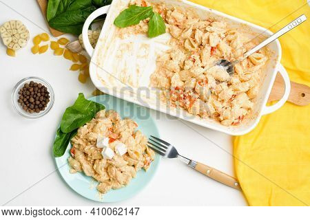 Trend Oven-baked Feta Cheese With Tomatoes And Pasta, Pepper Garlic On A Light Background Top View,