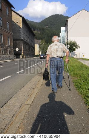 Senior Man With A Walking Stick