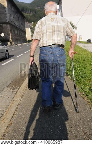 Senior Man With A Walking Stick