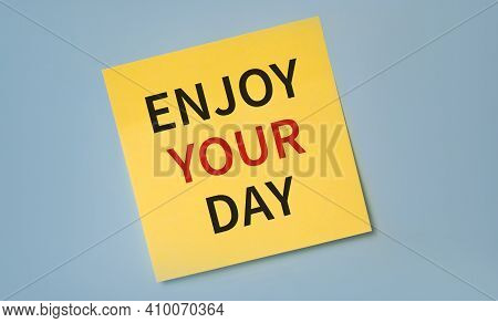 Enjoy The Weekend Written On Yellow Stocker Against Blue Background.happiness And Relax Concept. Hap
