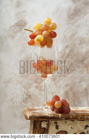 Bunch Of Pink Grapes Over Rustic Background