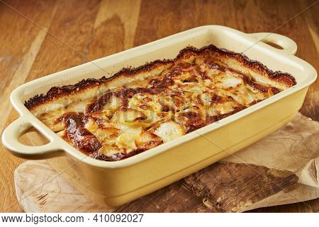 Potatoes With Mushrooms In Special Shape On Wooden Stand After Baking In The Oven. Step By Step Reci