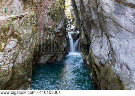Waterfall In The Areuse Gorge Surrounded By Steep Cliffs, Switzerland.