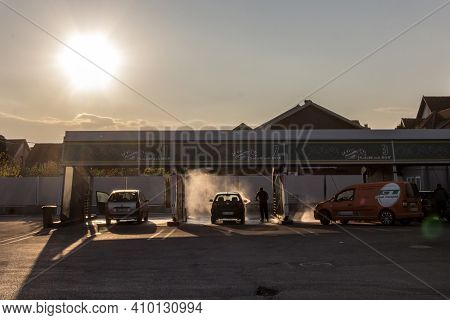 Belgrade, Serbia - April 7, 2019: People Washing Their Cars With High Pressure Water Hoses In A Car 