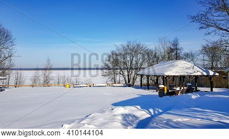 Winter Landscape Near The Kisezers Lake Covered With Ice In Mezapark, Riga, Latvia