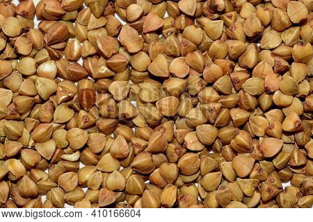 Macro Photo Of Buckwheat Groats. Grains Buckwheat Groat Texture Pattern For Background. Image Food P