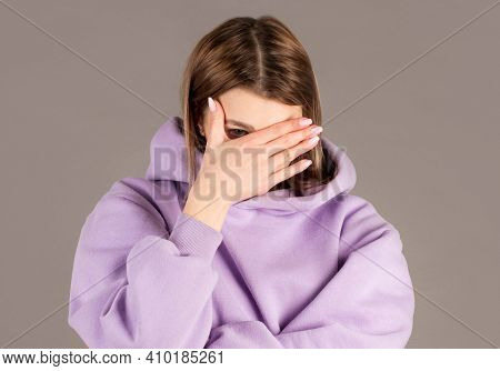 Portrait Of Annoyed Stylish European Girl Showing, Making Face Palm Gesture, Feeling Bored While Tal