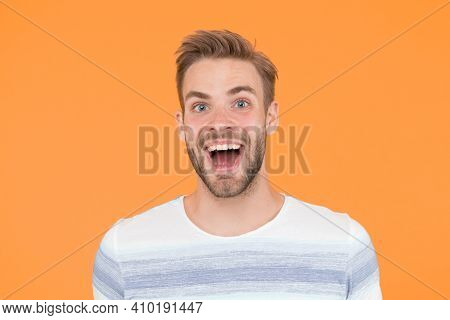 Hes Really Fun And Happy. Happy Man With Big Smile On Yellow Background. Handsome Guy With Beard And