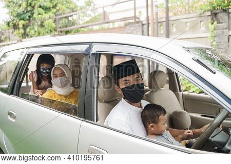 Muslim Family Wearing Face Mask During Travel By Car