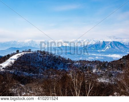 The Snow-covered Peaks Of The Japanese Alps As Viewed From Near The Summit Of The Shiga Kogen Ski Ar