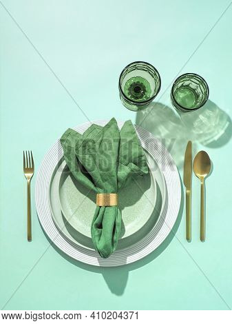 Beautiful Festive Table Setting In Green Colors For St.patricks Day With Golden Cutlery. Top View Of