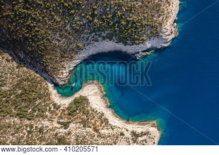 Aerial Overhead Drone Shot Of Yacht On Adriatic Sea Curvy Cove On Vis Island In Croatia Summer Morni