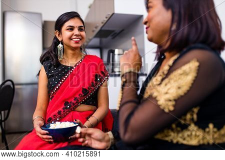 Two Indian Woman Spending Time Together In Living Room
