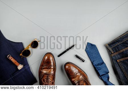 Men Clothes Concept. Vintage Style. Flat Lay On Light Grey Background. Included Wingtips Dress Shoes