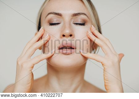 Young Adult Woman Doing Facial Gymnastics Self Massage And Rejuvenating Exercises Face Building For 