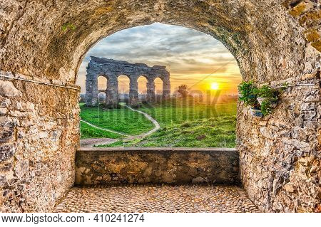 Scenic Rock Arch Balcony Overlooking The Iconic Ruins Of Parco Degli Acquedotti, Rome, Italy