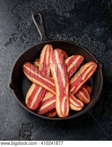 Fried Crunchy Plant Based Vegan Bacon Pieces In A Cast Iron Skillet