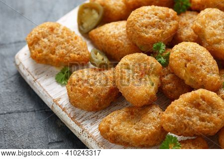 Crispy Jalapeno Popper With Creamy Cheese Battered On White Wooden Board