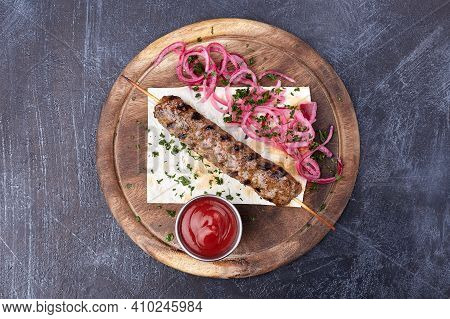Lula Kebab With A Red Onion And Salade, Traditional Caucasian Dish.