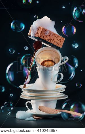 Dirty Dishes And Coffee Cups With Sponges And Bubbles, Mundane Beauty Concept