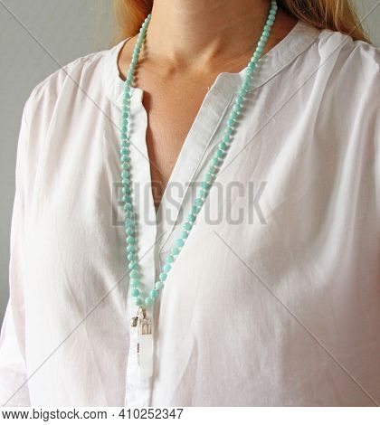 Rosary Mala 108 Beads From Natural Stones Mint Amazonite Are Worn On A Girl In A White Shirt. Author