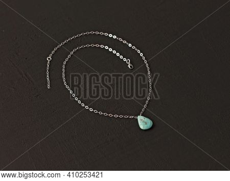 A Pendant Made Of Natural Stone Turquoise Silver Chain. Author's Jewelry From Natural Stones. Design