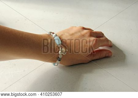 Asymmetric Aquamarine Bracelet. A Bracelet Made Of Stones On A Hand From A Natural Stone Aquamarine.