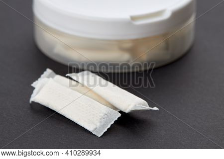 Snus Tobacco Pouch Product Over Black Background. Copy Space. Alternative Chewing Nicotine Smoking.