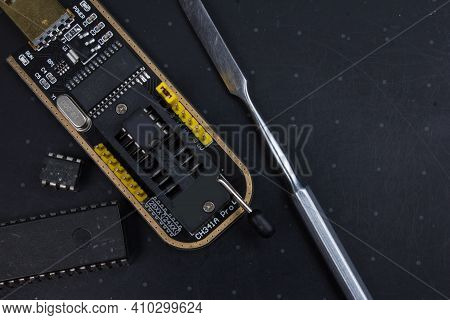 Programmer With Inserted Microchip Memory. Electronics Repair