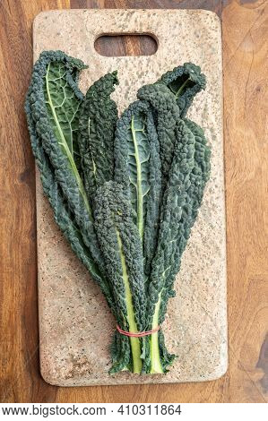 Cooking With Black Flat Leaves Of Cavolo Nero Tuscan Cabbage