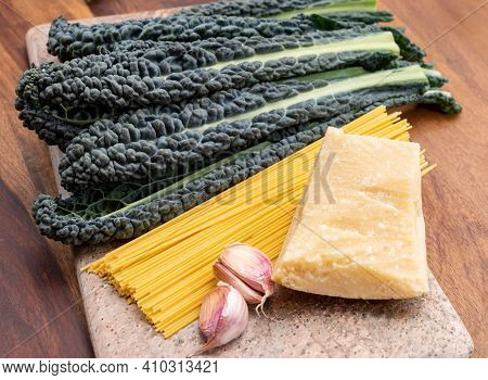 Cooking With Black Flat Leaves Of Cavolo Nero Tuscan Cabbage