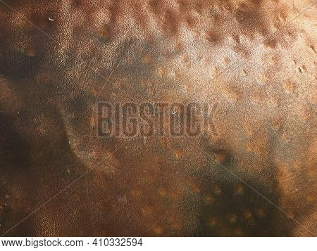 Metal Bronze Textured Plate. Bronze Or Copper Polished Surface With Dents, Scratches And Indentation