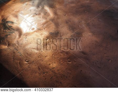 Metal Bronze Textured Plate. Bronze Or Copper Polished Surface With Dents, Scratches And Indentation