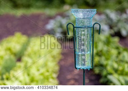 Meteorology With Rain Gauge In Garden After The Rain