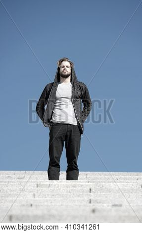 Reach Out For Top. Man Handsome Guy Enjoy Morning Walk On Stairs Blue Sky Background. Morning Fill E