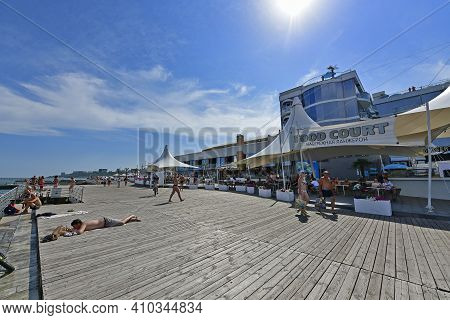 Ukraine, Odessa 07/27/2020. Lanzheron Beach. A Picturesque Embankment With Palm Trees, Fountains, Ge